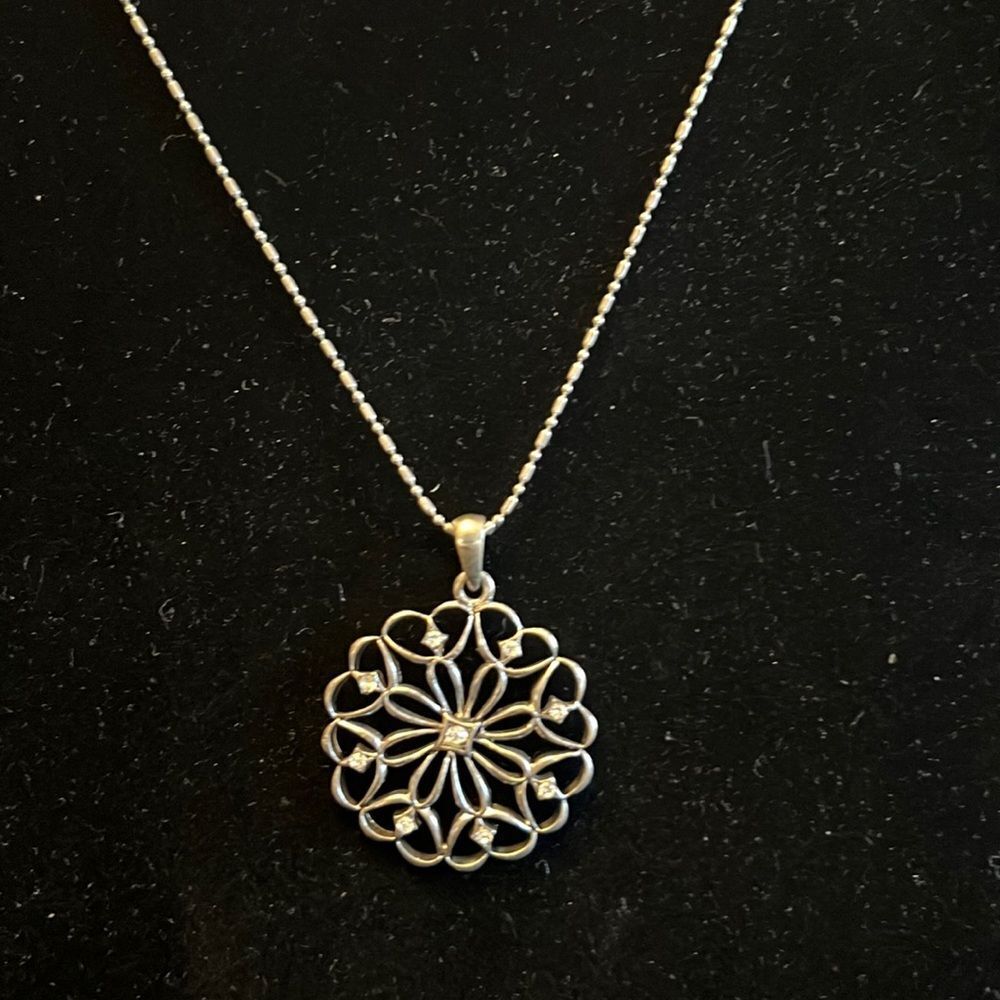 Handcrafted round pendant on 16 inch silver tone chain